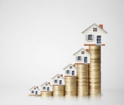 Mortgage concept by money house from the coins